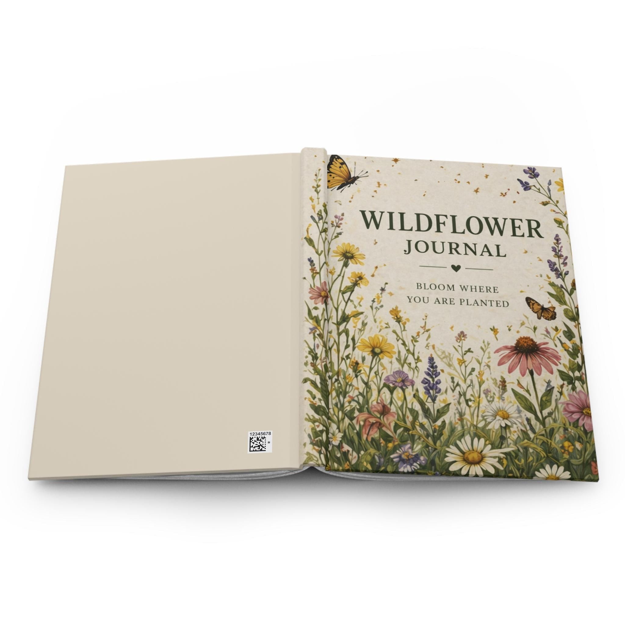An open journal displaying its plain cream back cover and the wildflower-designed front cover.