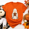 Cozy Ghost Holding Pumpkin Mug Tee | Halloween Cute Ghost Shirt