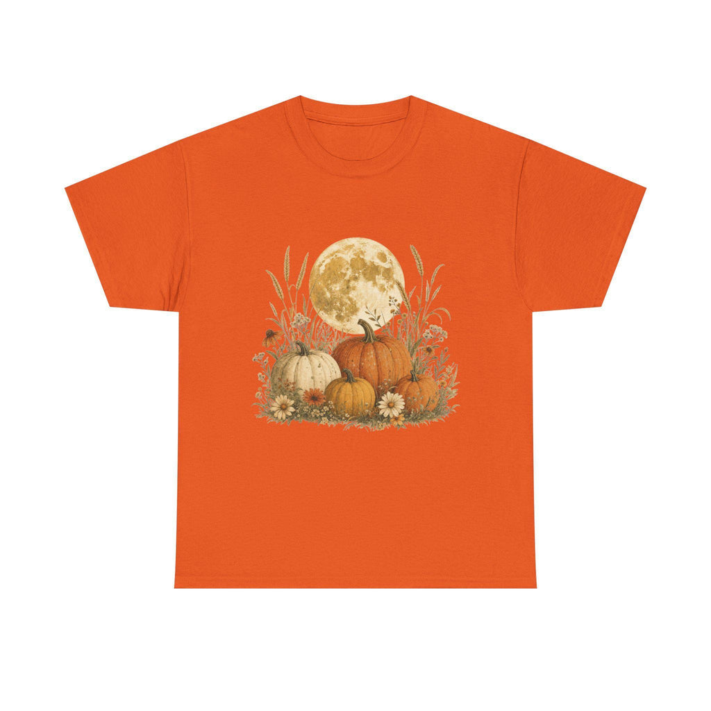 An orange t-shirt with a graphic of a full moon behind a patch of pumpkins, tall grass, and flowers.
