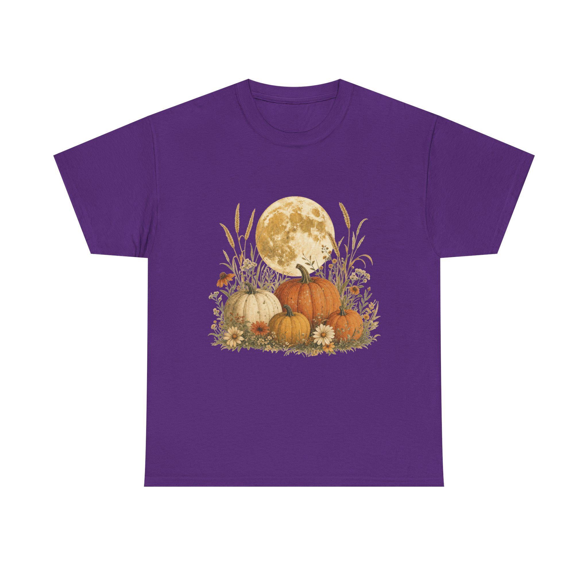 A purple t-shirt with a graphic of a full moon behind a patch of pumpkins, tall grass, and flowers.