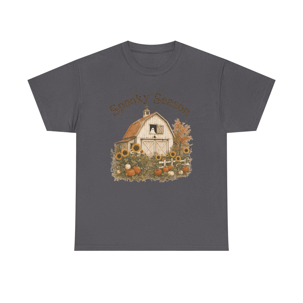 A dark gray t-shirt with a graphic of a barn, sunflowers, pumpkins, and a ghost in a window, with "Spooky Season" text.