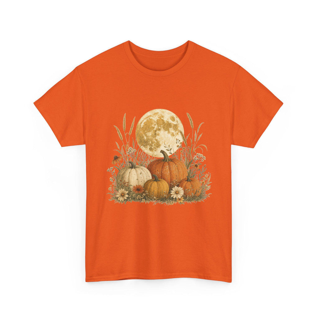 An orange t-shirt displays a graphic of a large full moon behind a cluster of pumpkins, tall grasses, and small flowers.