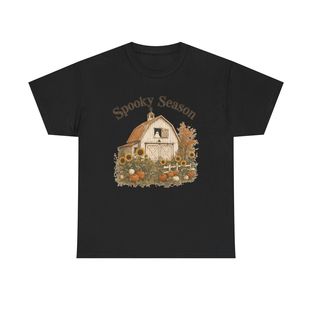 A black t-shirt with a graphic of a barn, sunflowers, pumpkins, and a ghost in a window, with "Spooky Season" text.